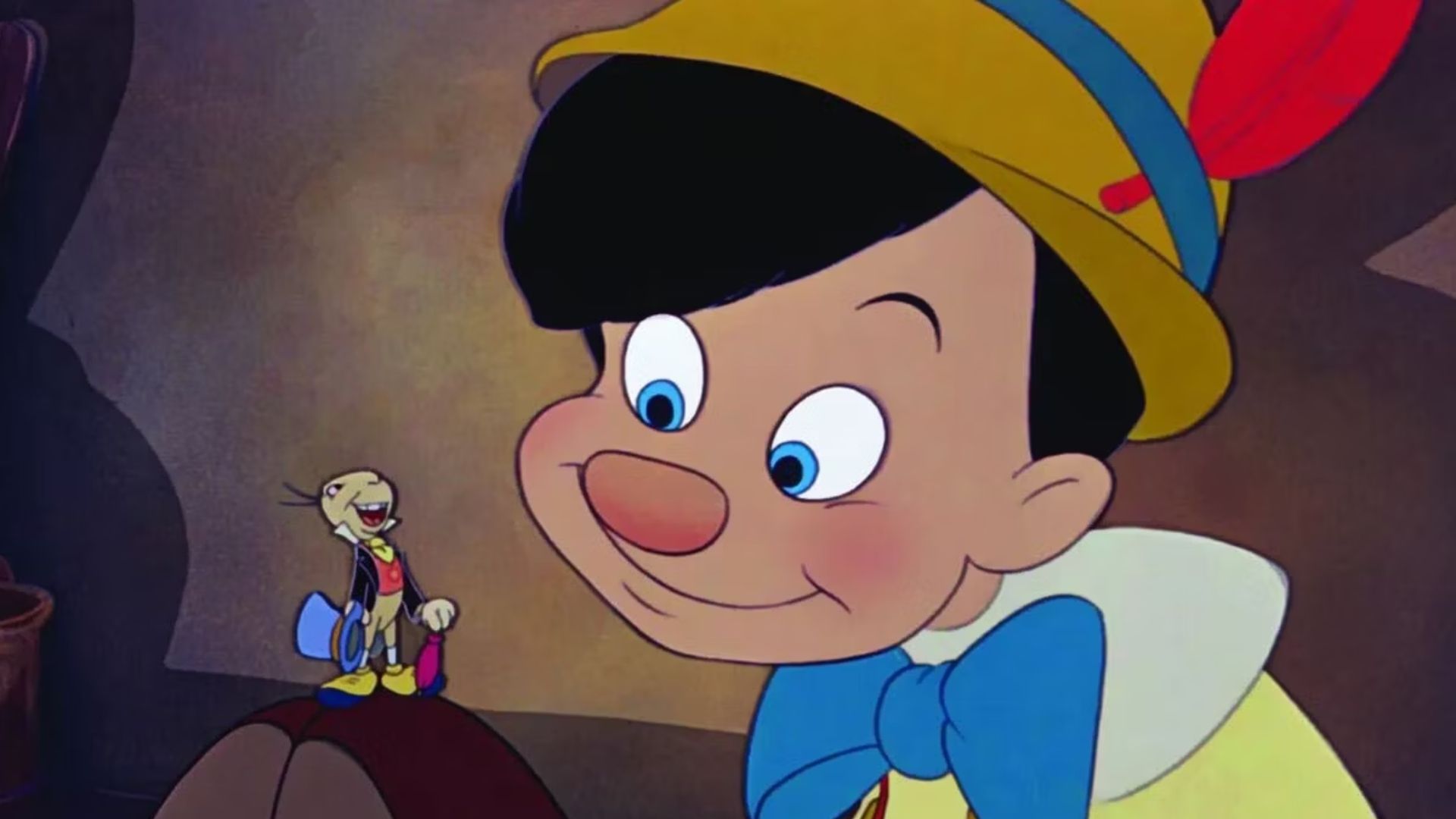 Pinocchio looking at Jiminy Cricket on his feet in Pinocchio (1)