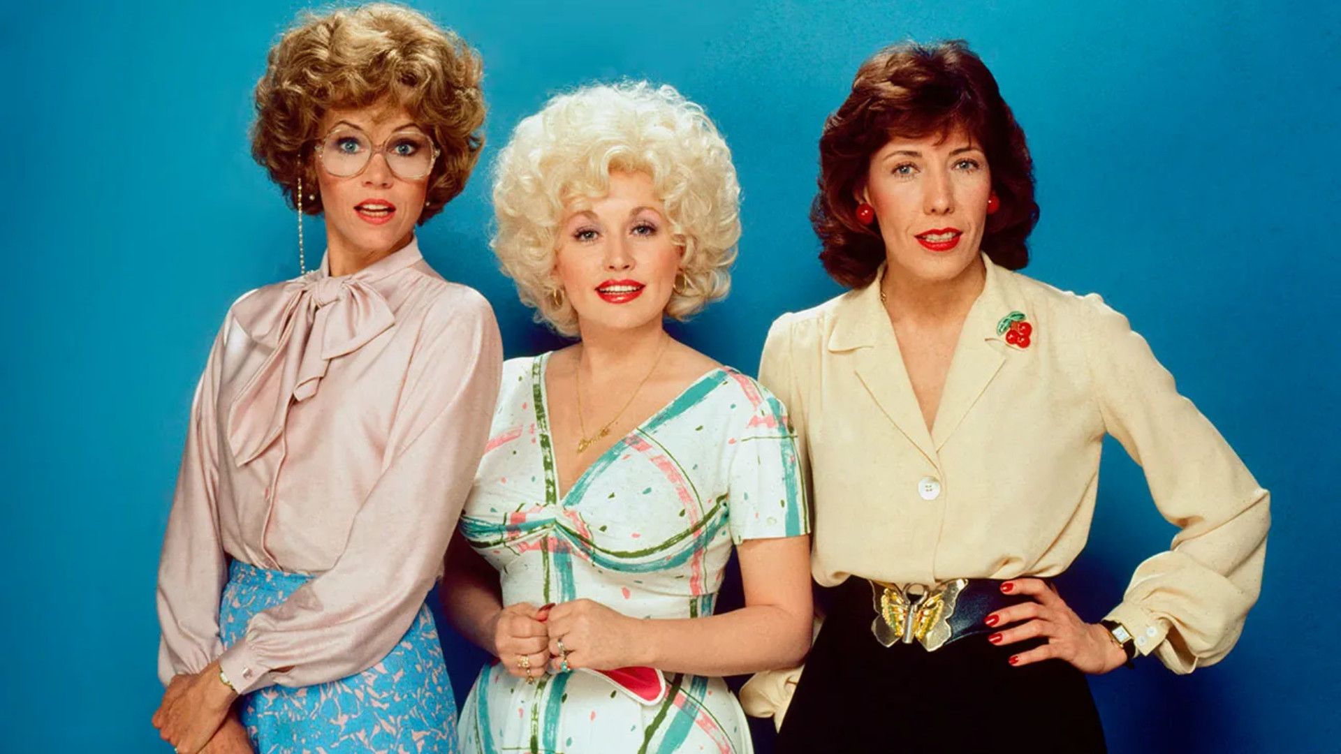 Jane Fonda, Dolly Parton, and Lily Tomlin pose in an image for 9 to 5