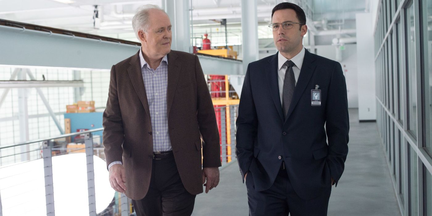 Lamar and Chris walk the factory in The Accountant