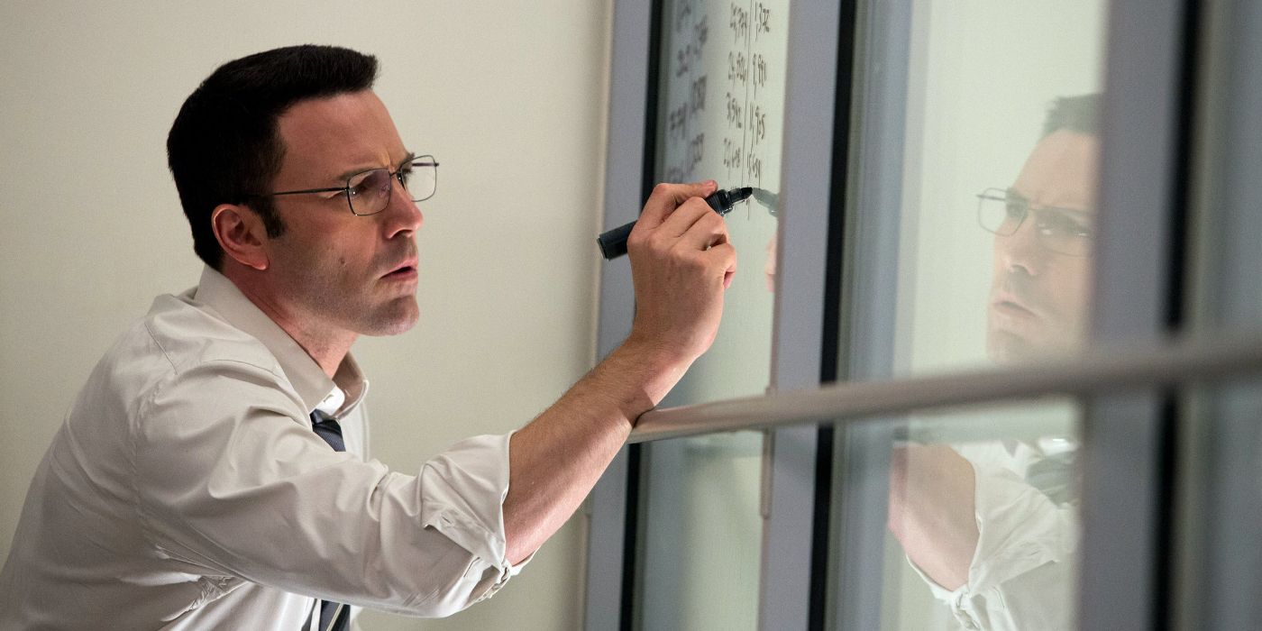 Chris writes equations on a window in The Accountant