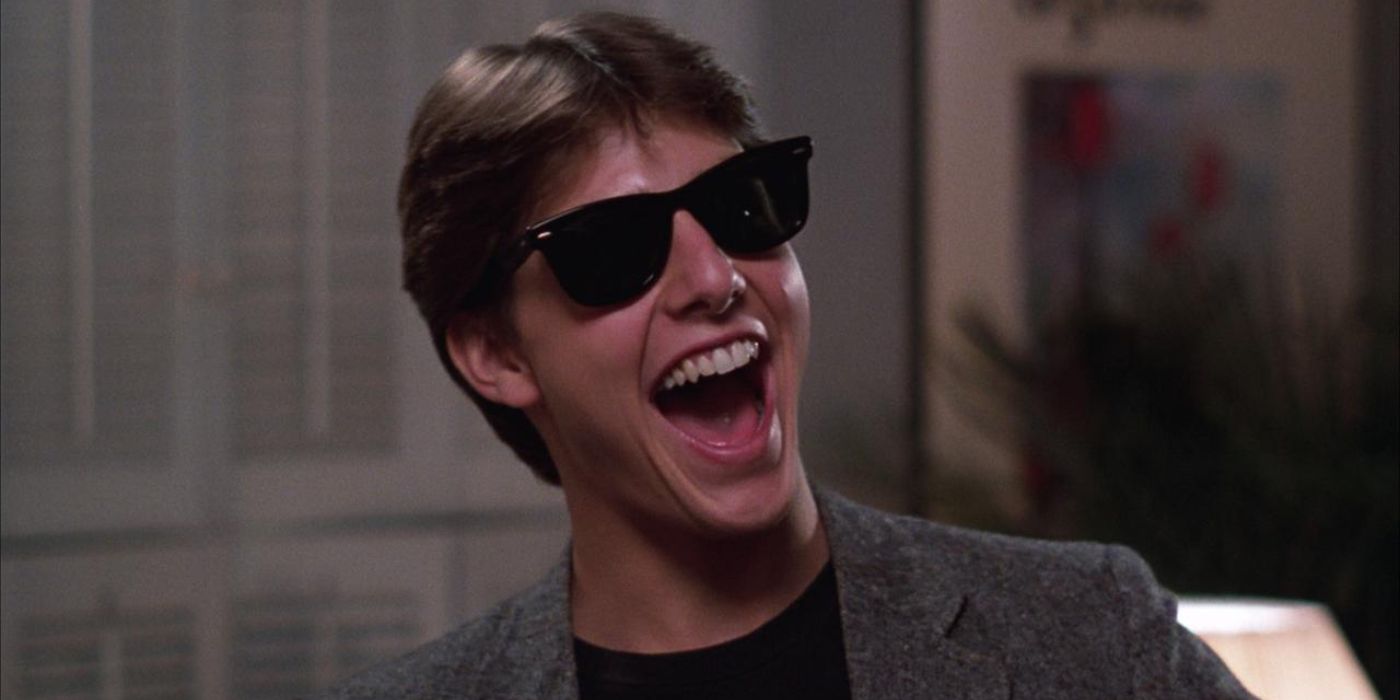 Tom Cruise with a big smile and sunglasses in Risky Business from 1983
