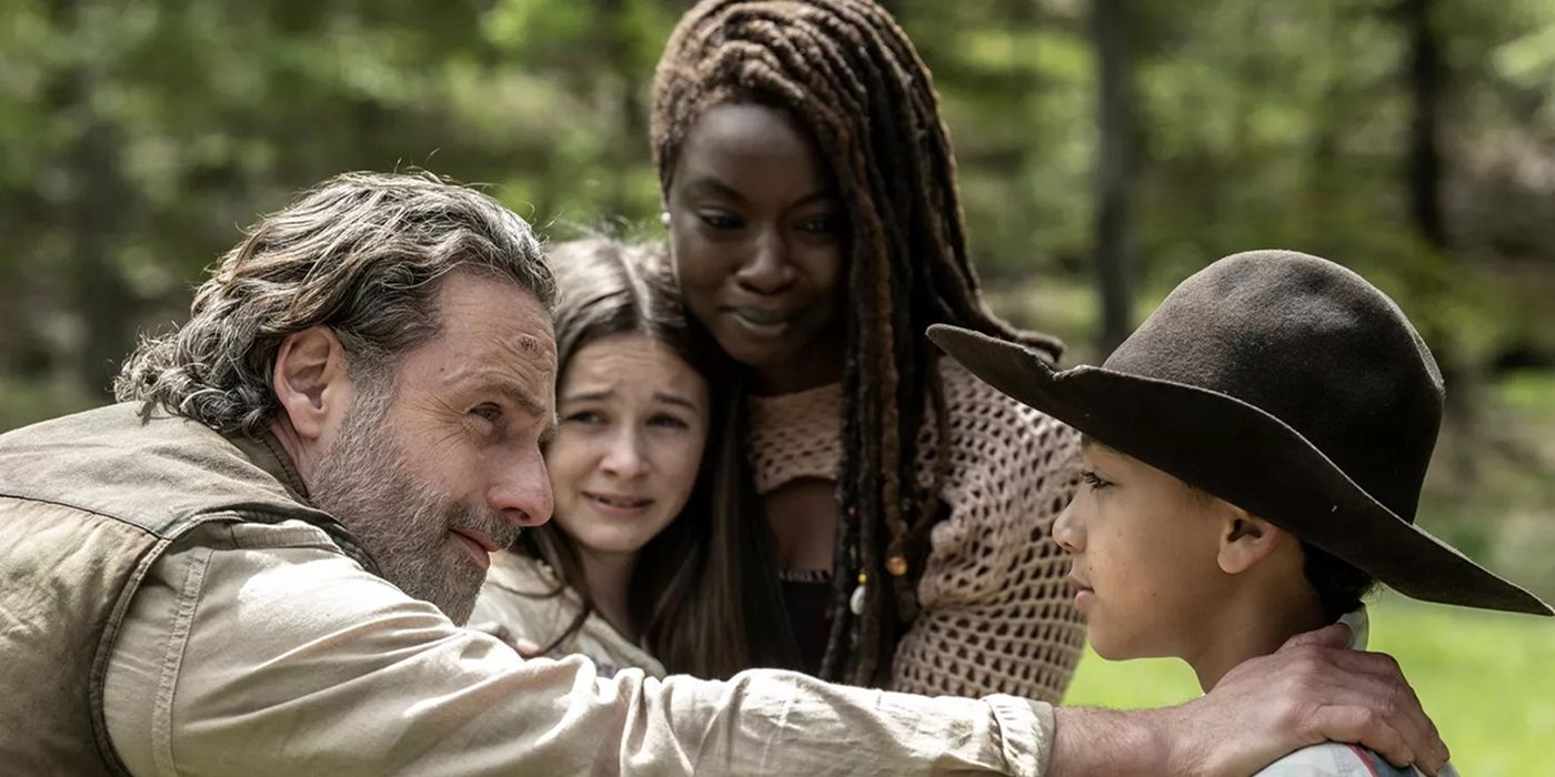 Rick meeting RJ for the first time, Michonne and Judith hugging them and looking on in The Walking Dead: The Ones Who Live.