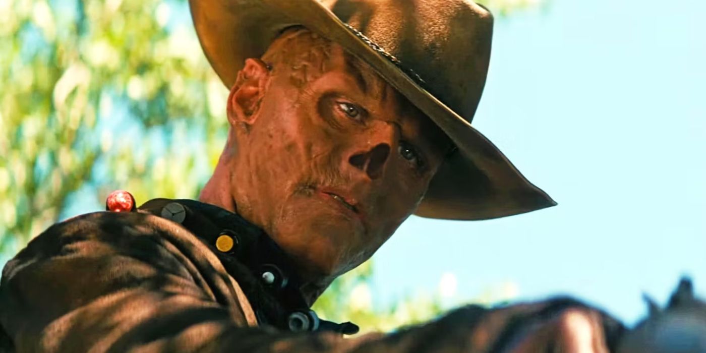 Walton Goggins as the Ghoul wearing a hat holding a pistol in Fallout