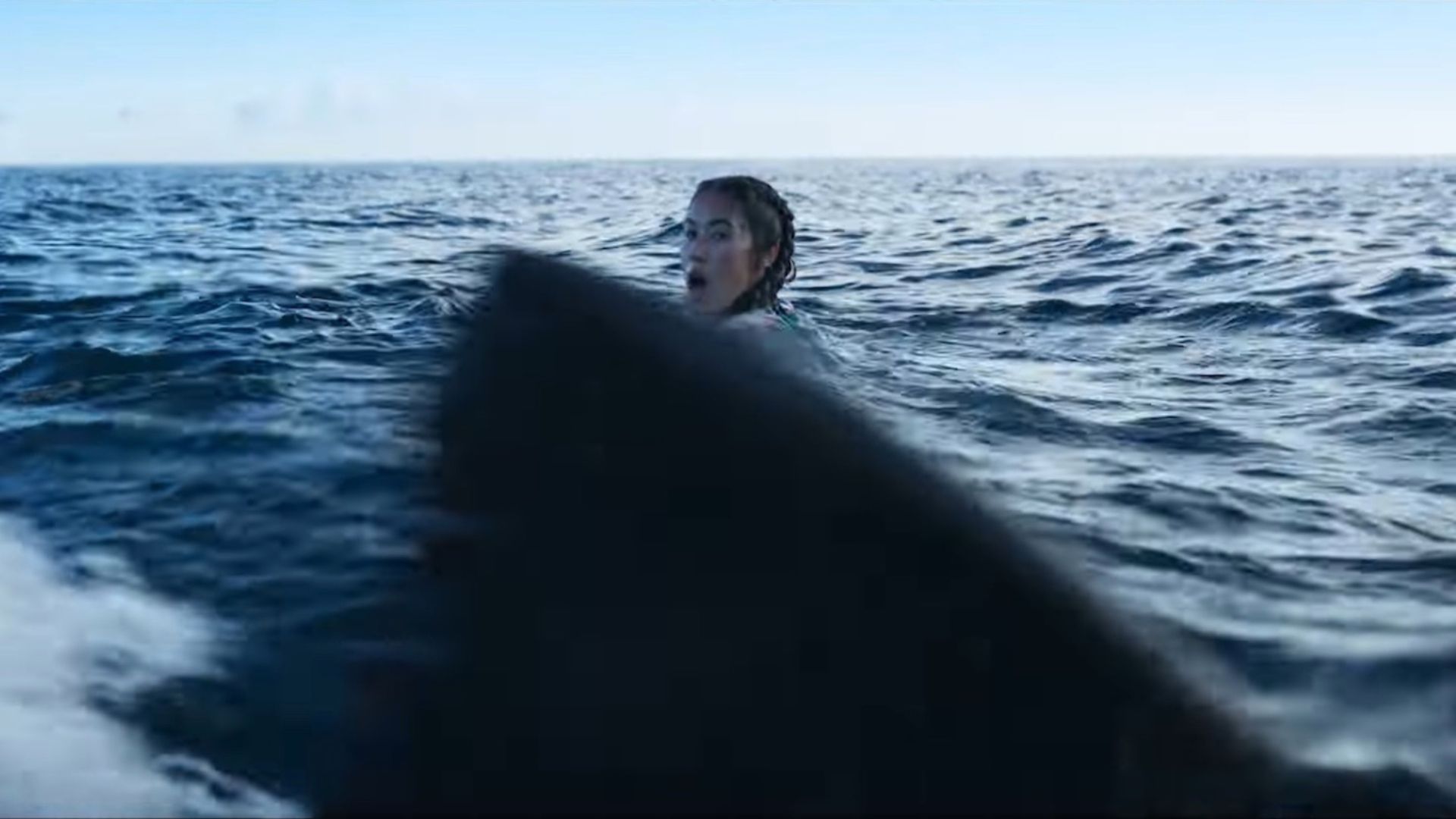 A shark hunts a woman in the movie Something in the Water