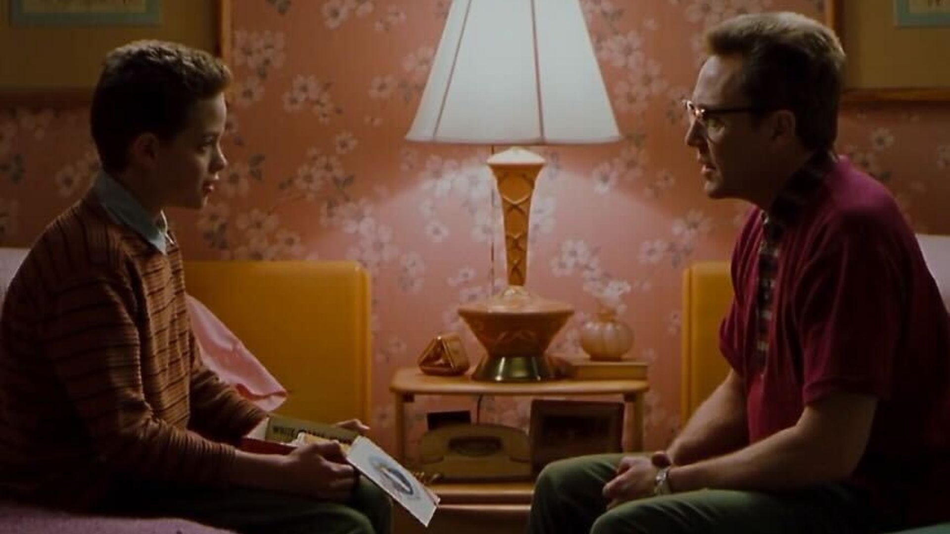 Christopher Walken talking to a young boy on a bed in Blast From the Past