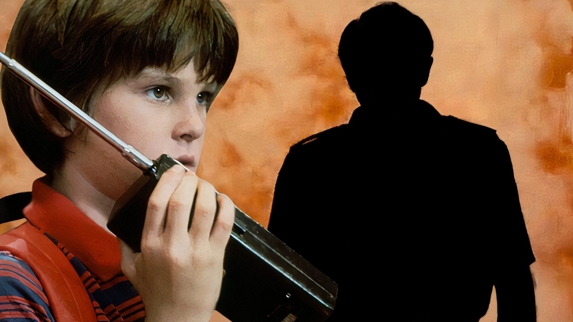 An edited image of Henry Thomas as Davey Osbourne talking into a walkie talkie in Cloak and Dagger