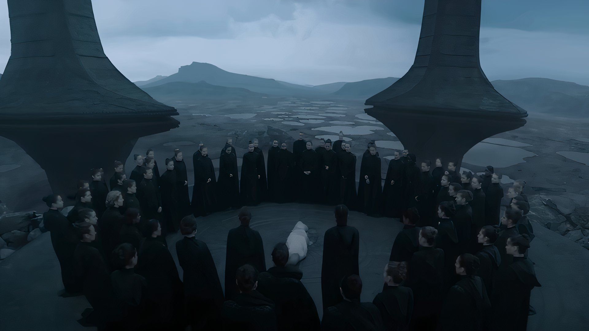 A Bene Gesserit gathering with many women circled around someone on the ground in Dune: Prophecy on Max