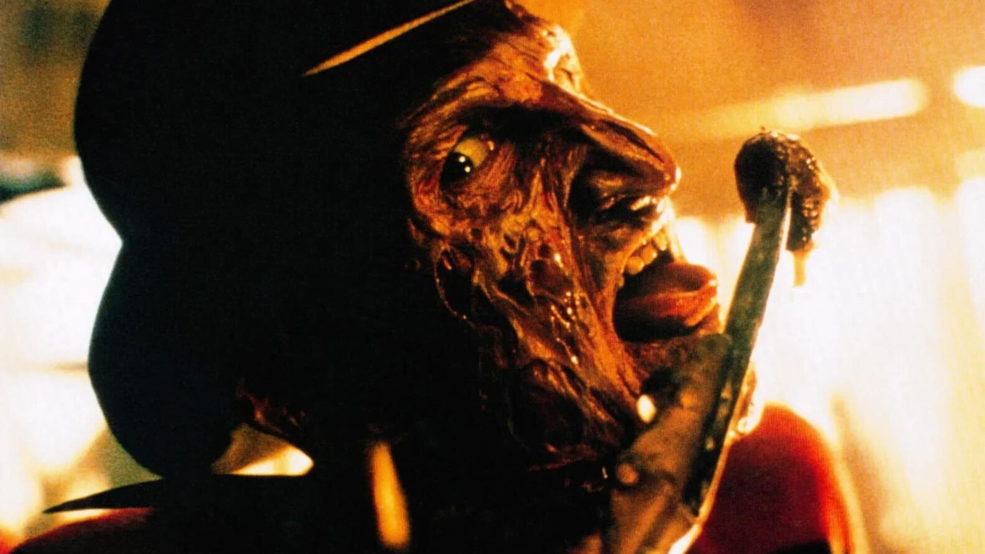 Freddy Kreuger licking his bloody sharp razor fingers in A Nightmare on Elm Street