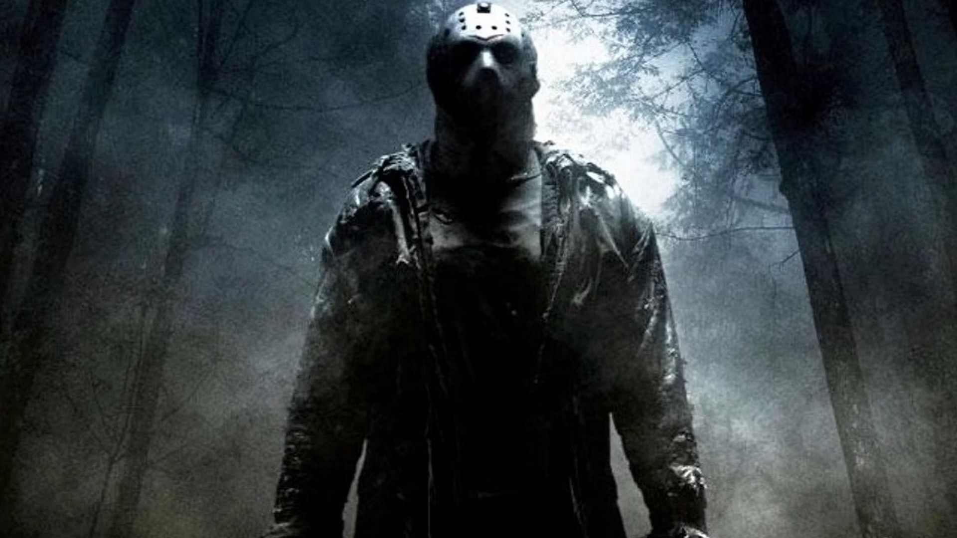 Jason Voorhees in Friday the 13th 2009 wearing a hockey mask and standing in a forest.