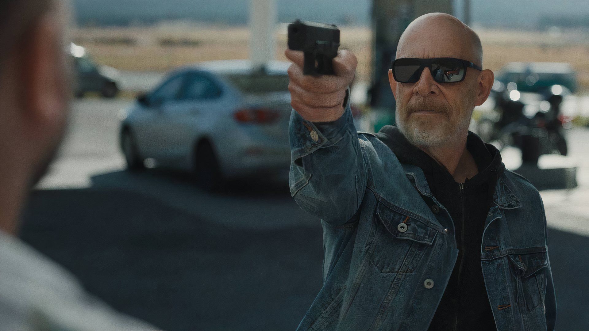 J.K. Simmons aiming a gun in You Can't Run Forever (2024)