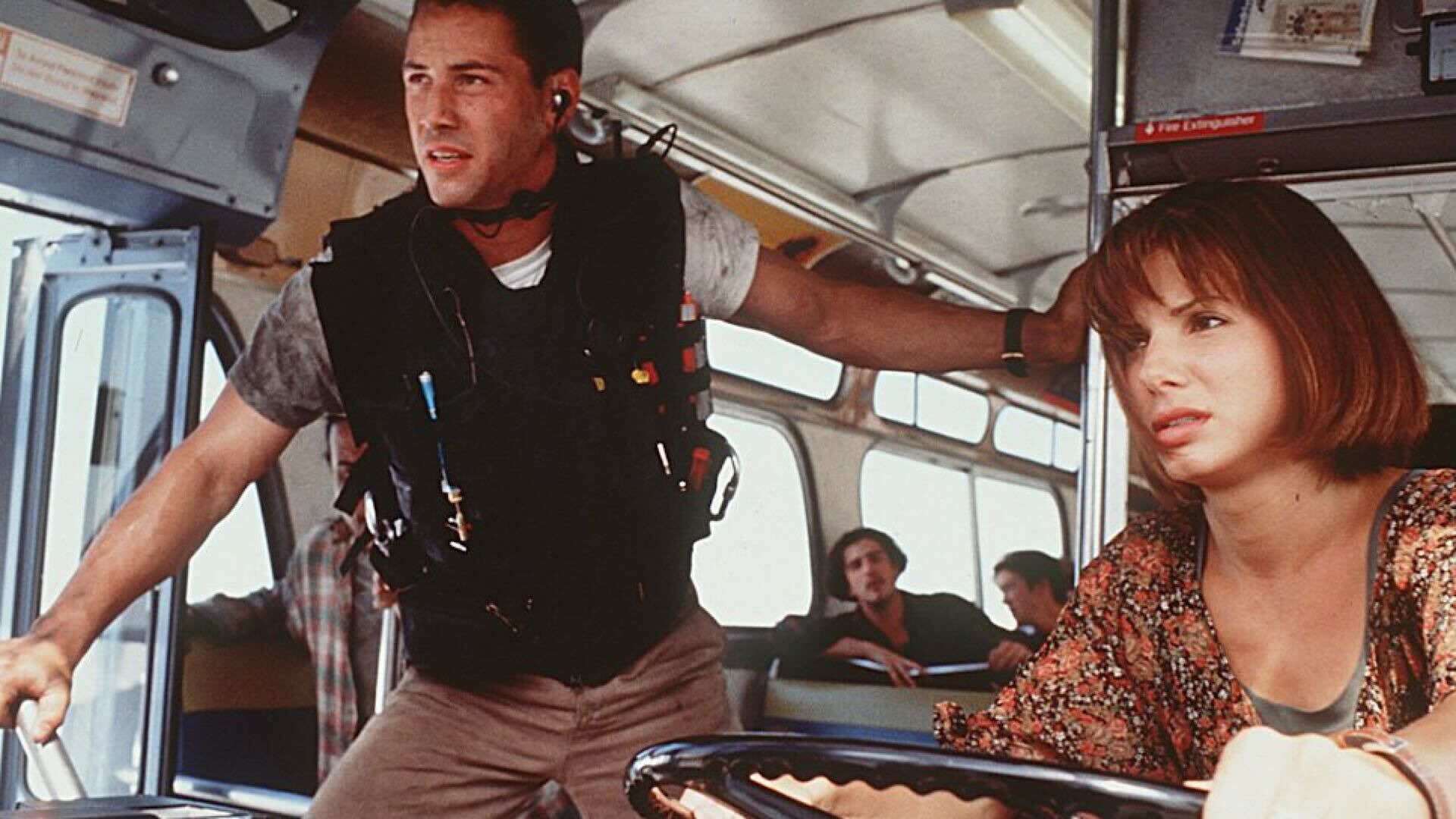 Keanu Reeves and Sandra Bullock in a scene on a bus from Speed