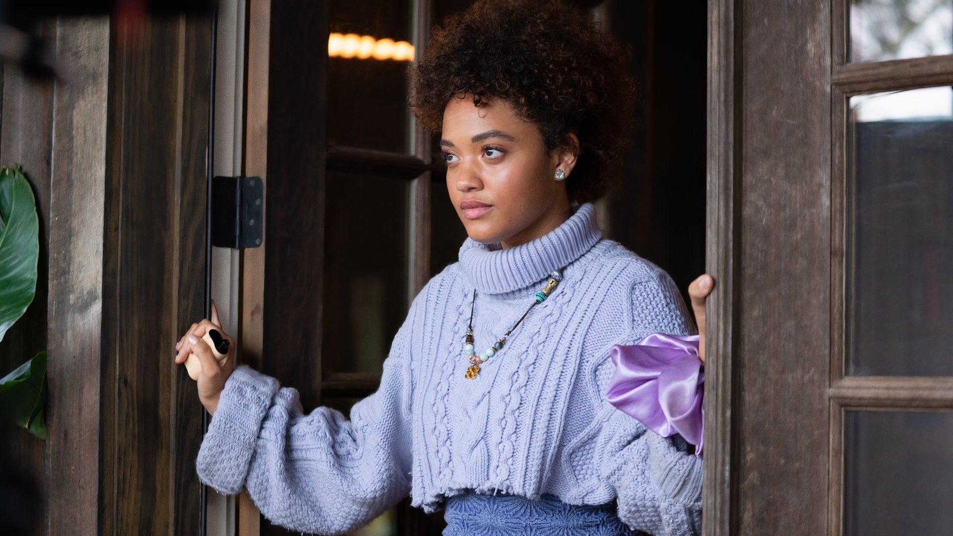 Kiersey Clemons in a blue sweater in The Young Wife