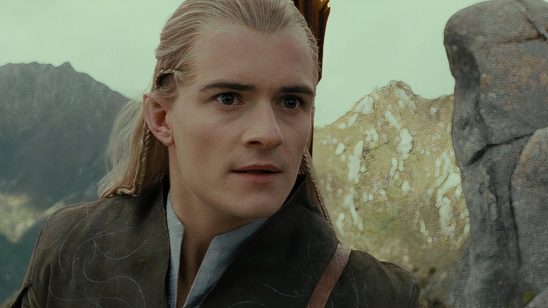 Orlando Bloom as Legolas looks in the distance in The Lord of the Rings: The Fellowship of the Ring