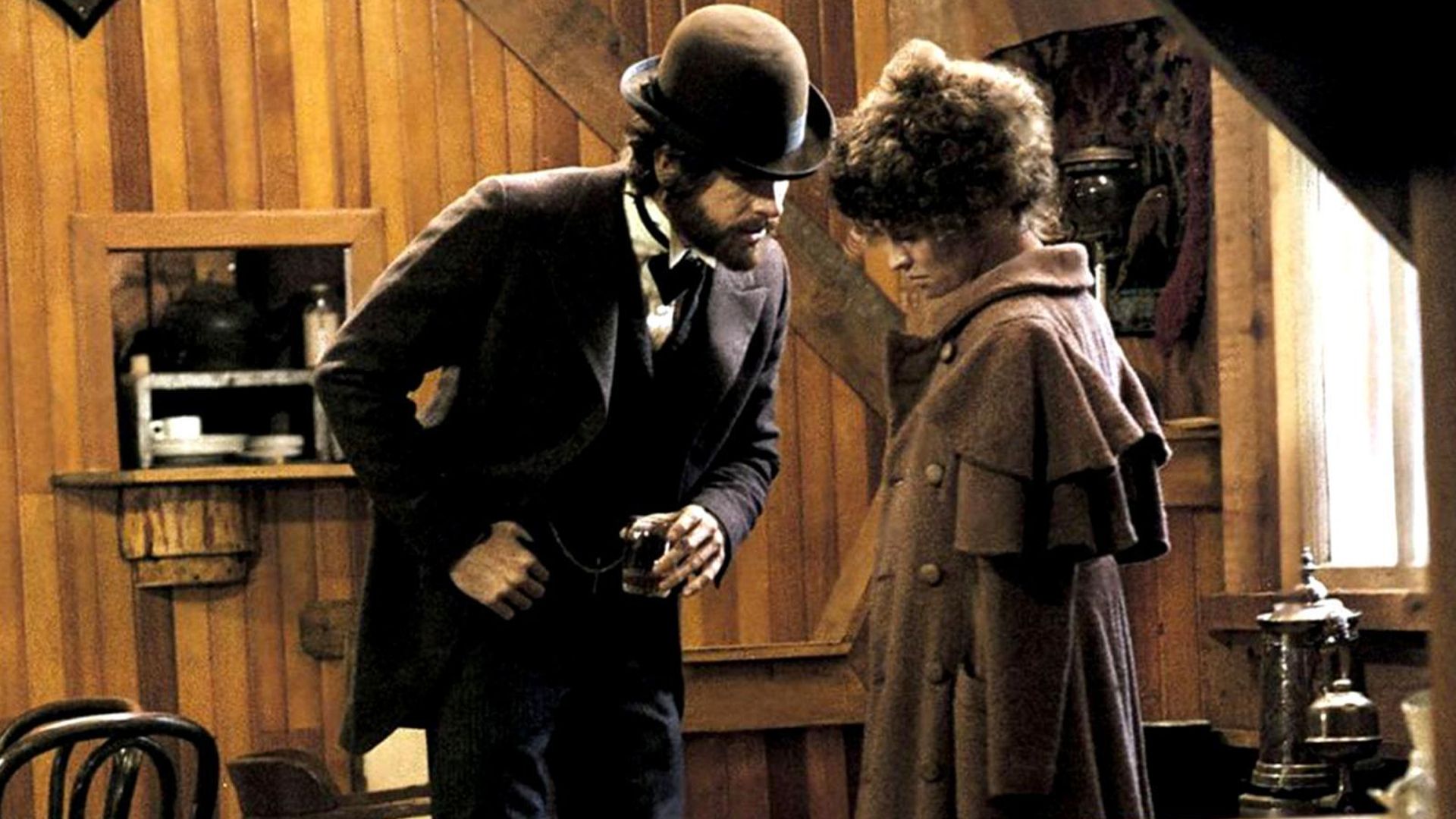 McCabe and Miller stand in a lodge in McCabe & Mrs. Miller