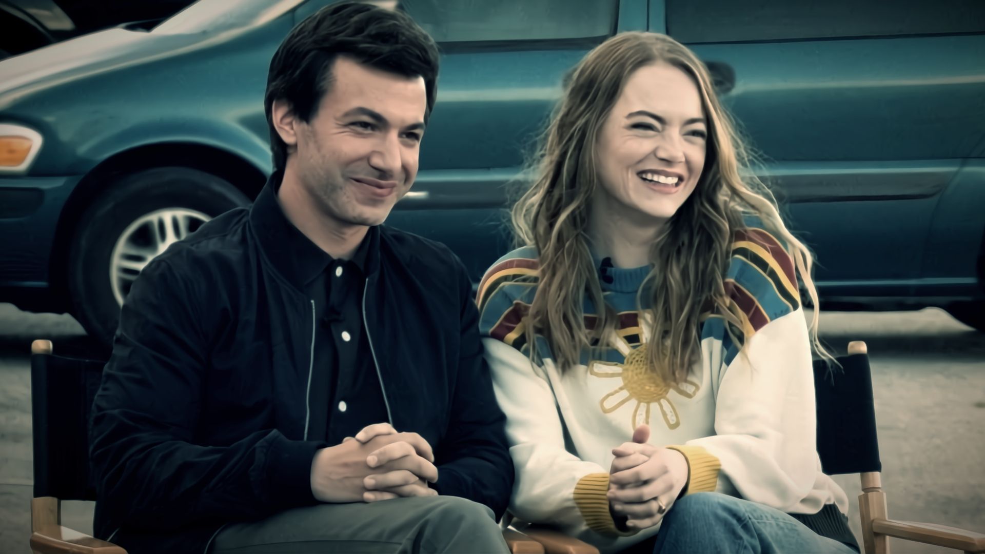 Nathan Fielder as Asher and Emma Stone as Whitney smile together at a camera in A24's The Curse