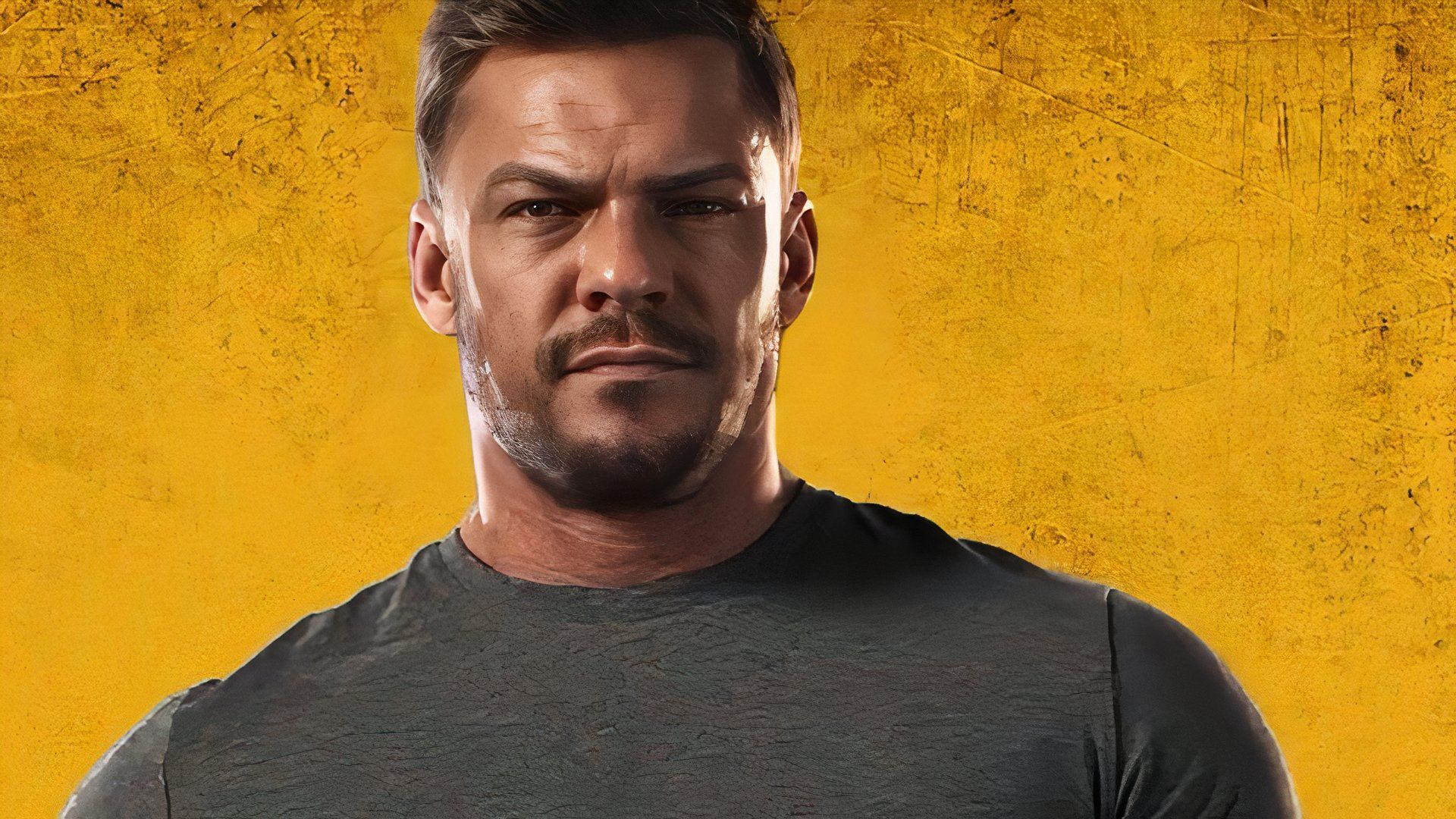 Alan Ritchson as Jack Reacher looking directly toward the camera with a yellow background