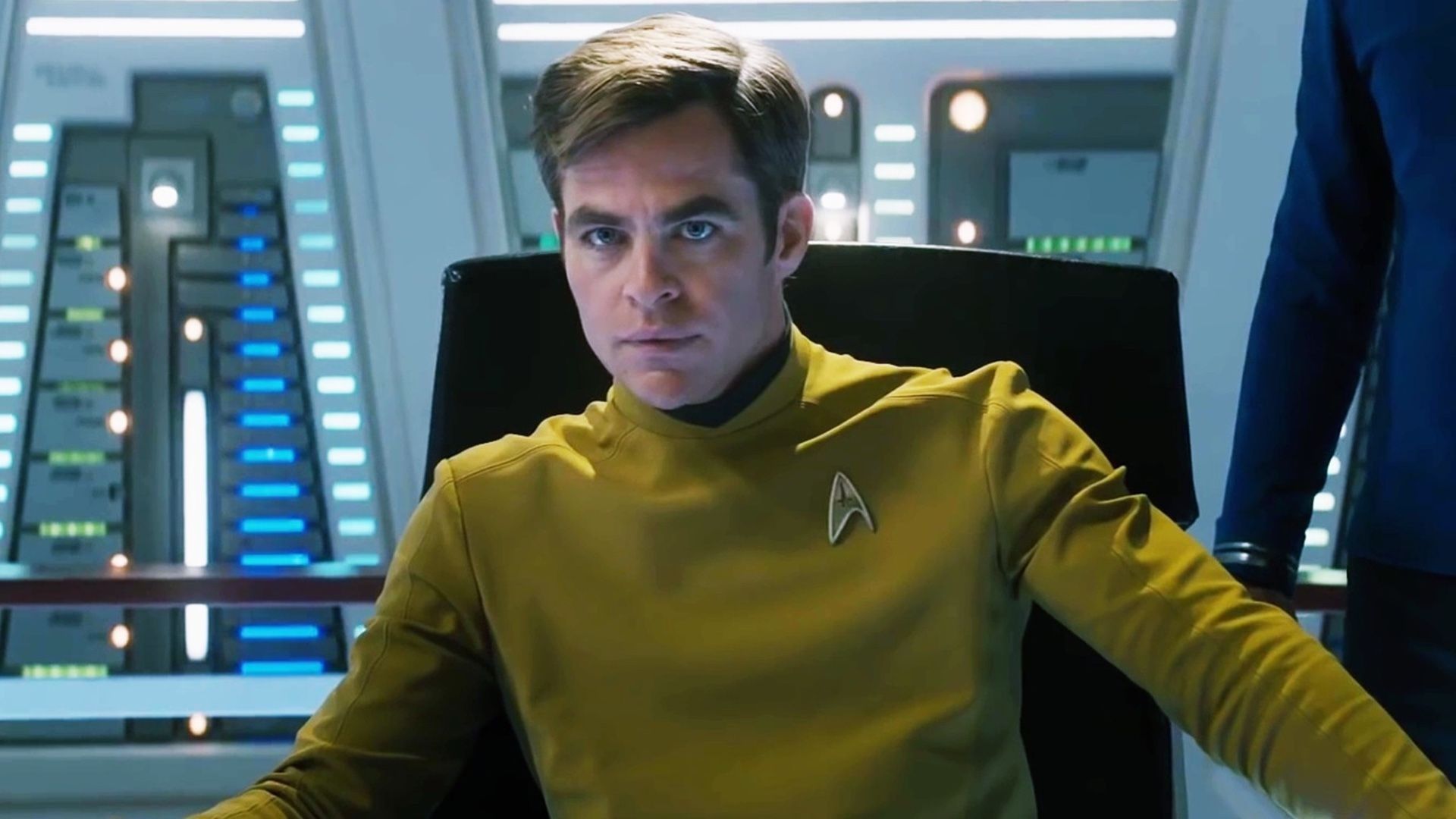 Chris Pine sits in the chair in Star Trek Beyond.