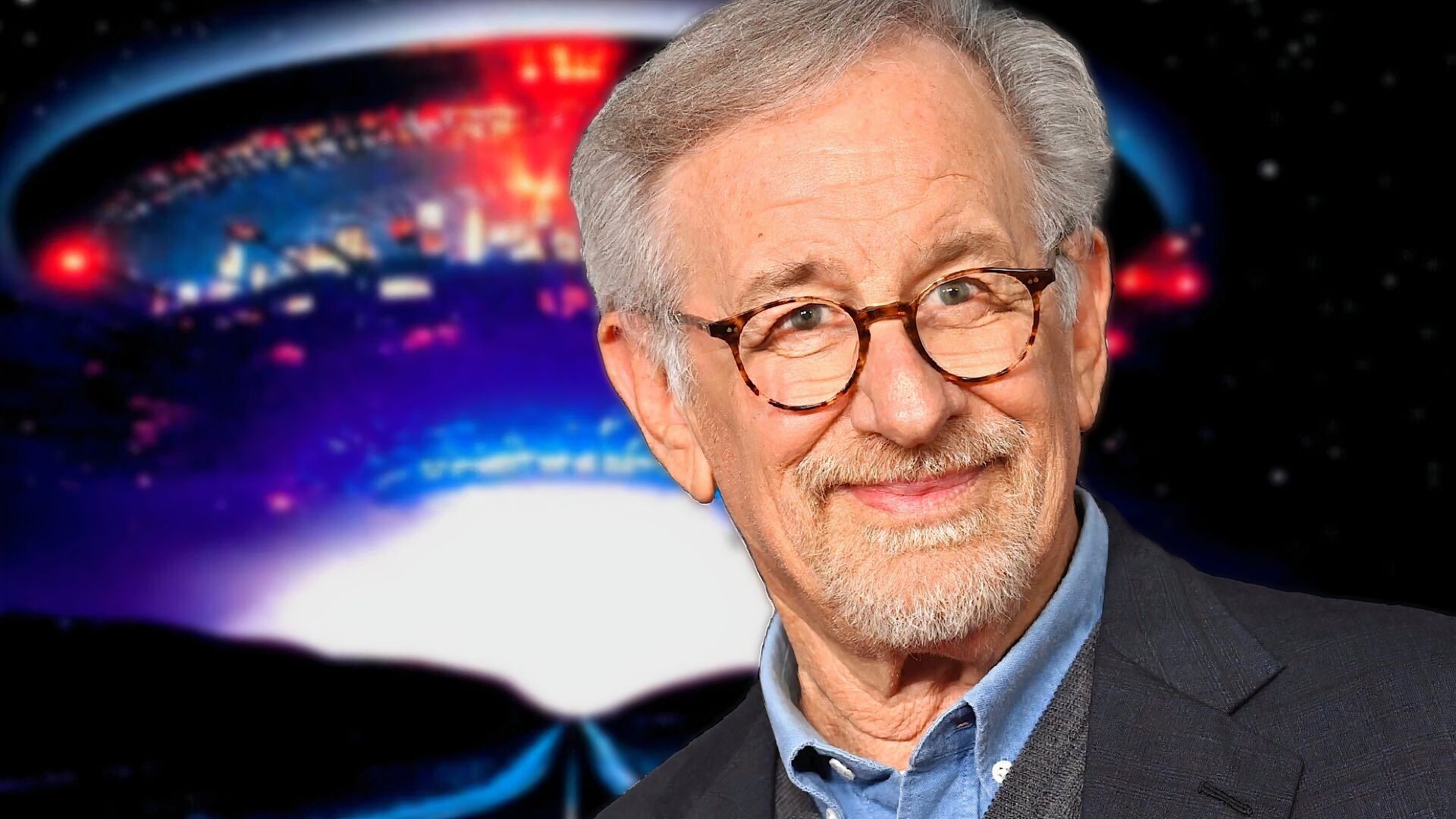 Steven Spielberg with an alien spaceship behind him