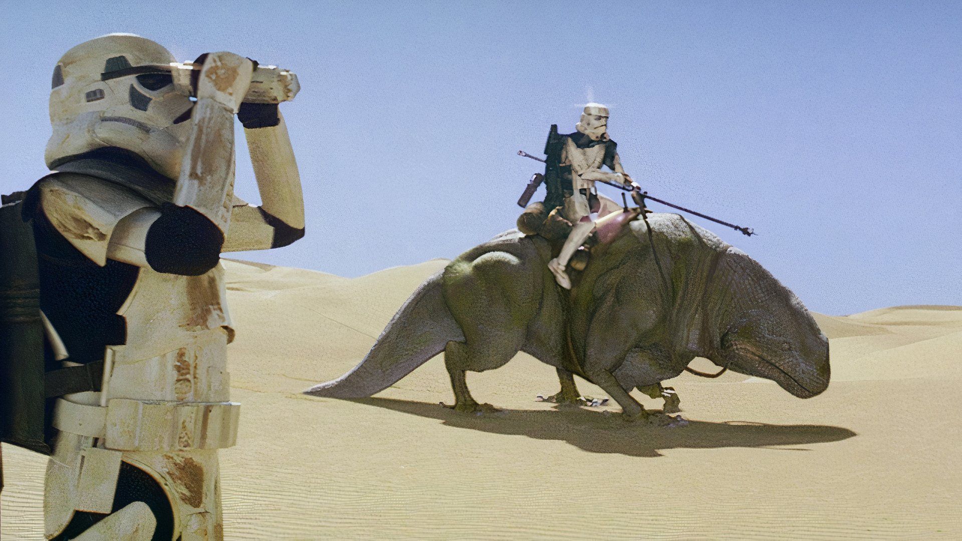 Sandtroopers search the Tatooine desert with Dewbacks in a scene from Star Wars: A New Hope