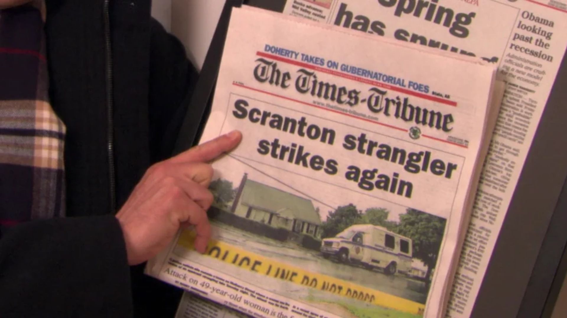 The Office TV show with a newspaper