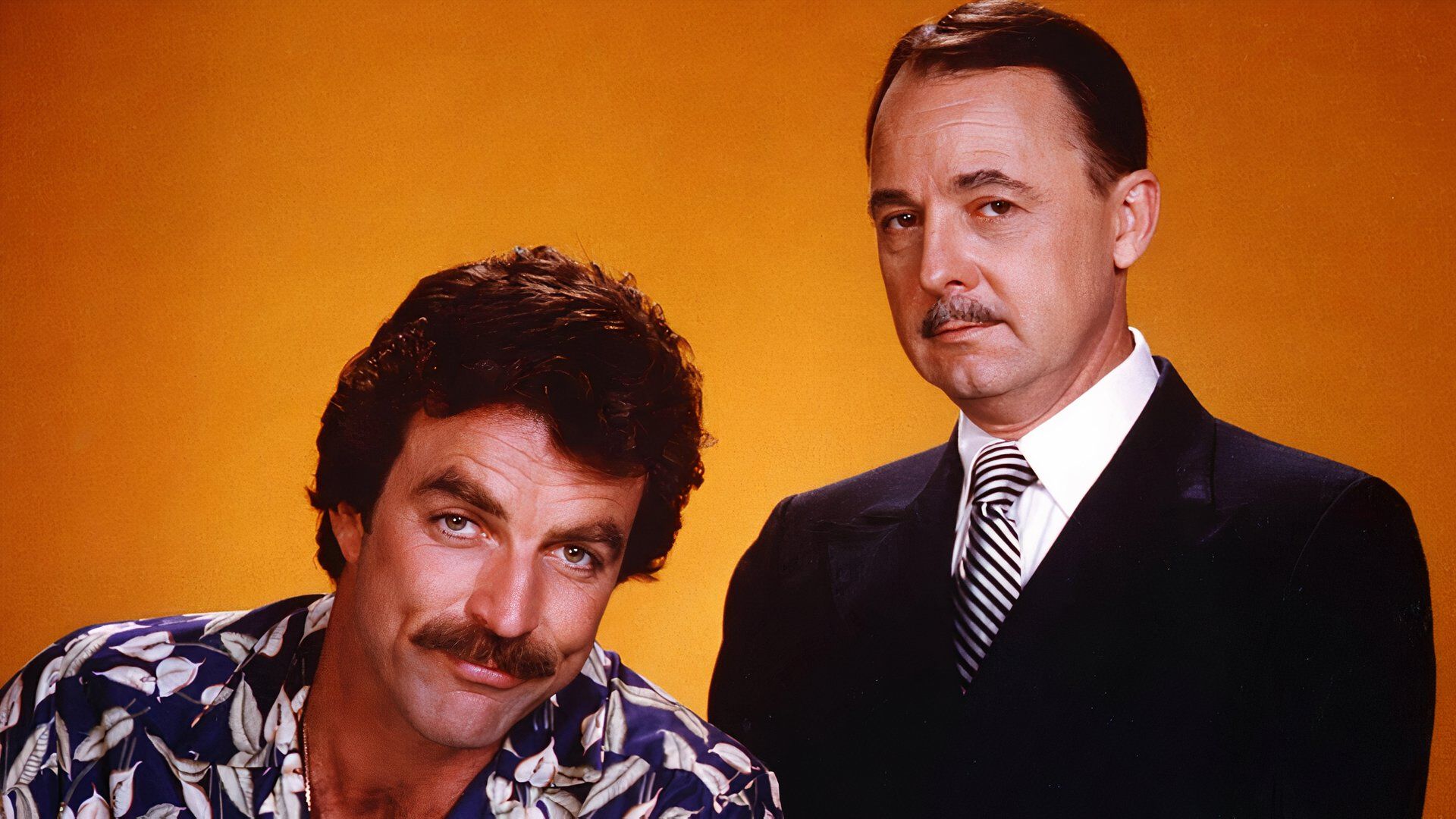 Tom Selleck as Thomas Magnum with man in tie