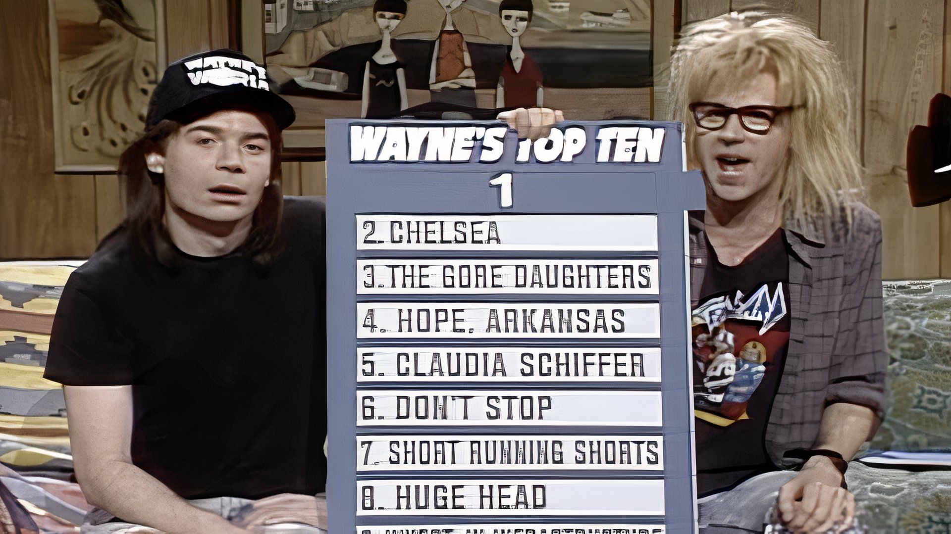 Wayne and Garth hold a scoreboard in the sketch wayne's world of saturday night live
