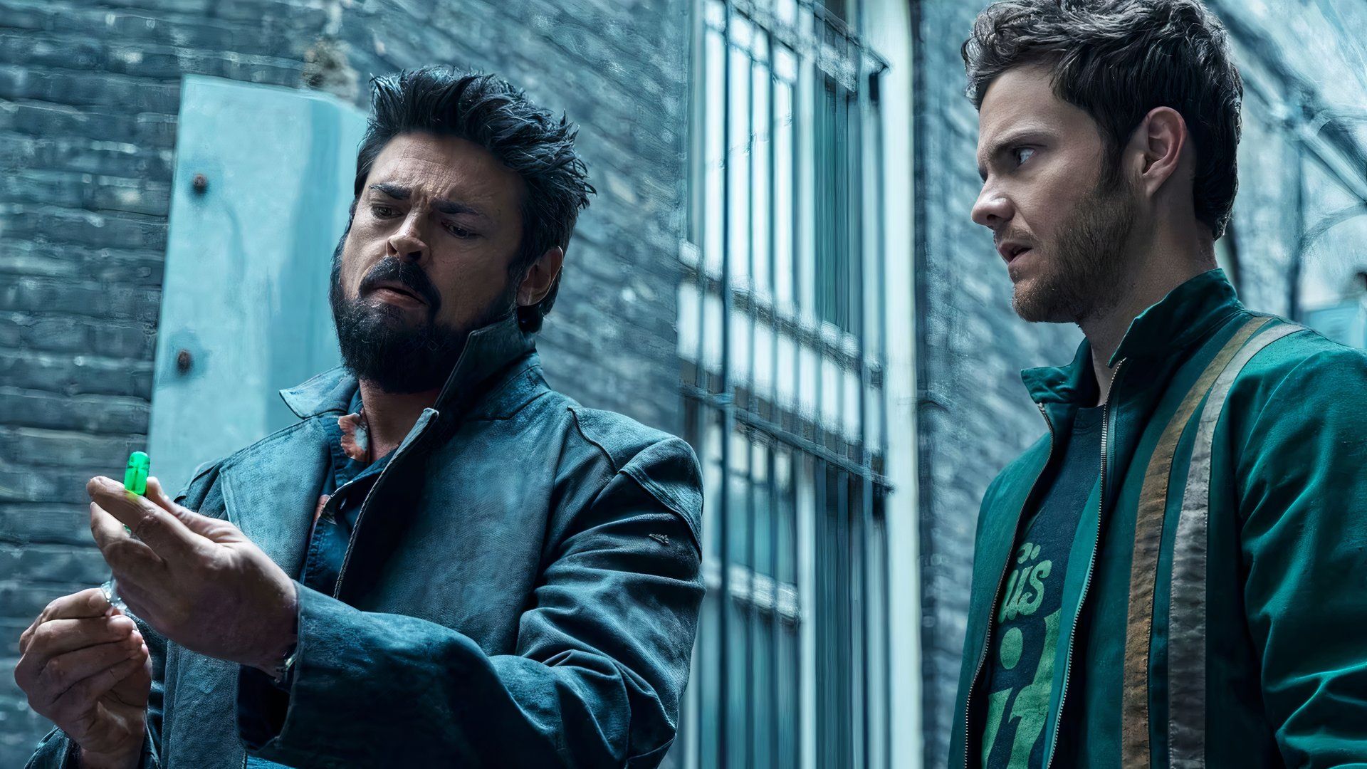 Jack Quaid as Hughy and Karl Urban as Billy Butcher looking at a syringe of Compound V in The Boys