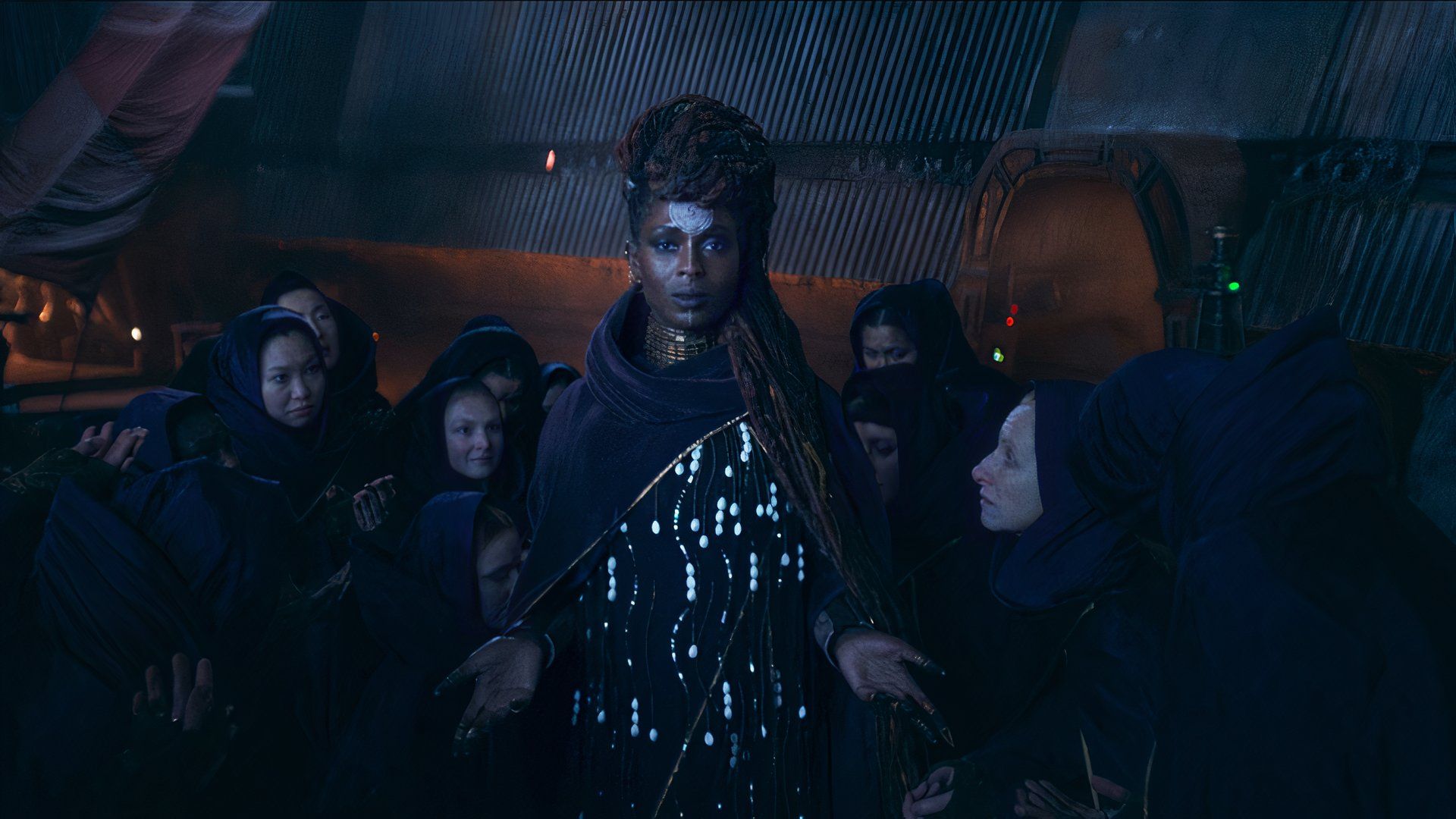 Jodie Turner Smith as Mother Aniseya from The Acolyte surrounded by witches