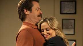 Ron and Leslie from Parks and Recreation awkwardly hugging