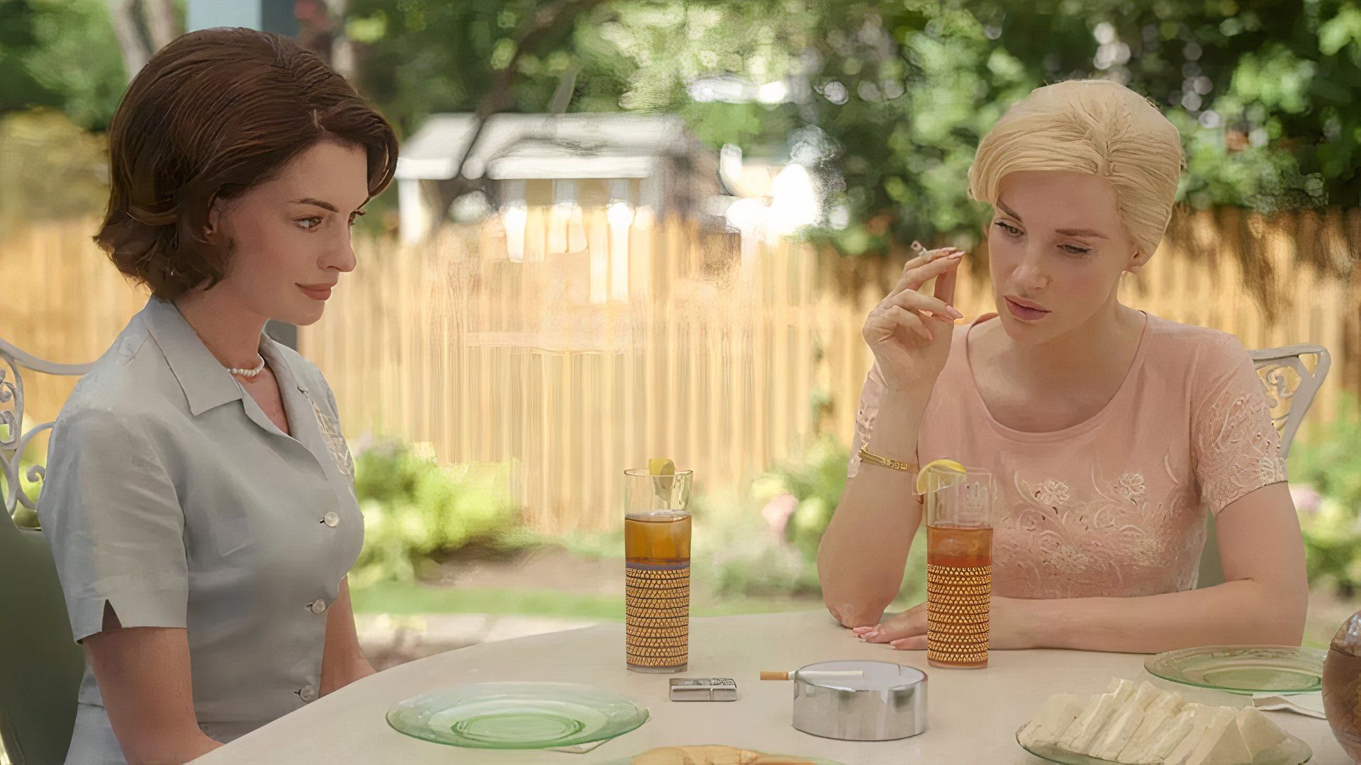 Celine and Alice sit outdoors in Mother's Instinct