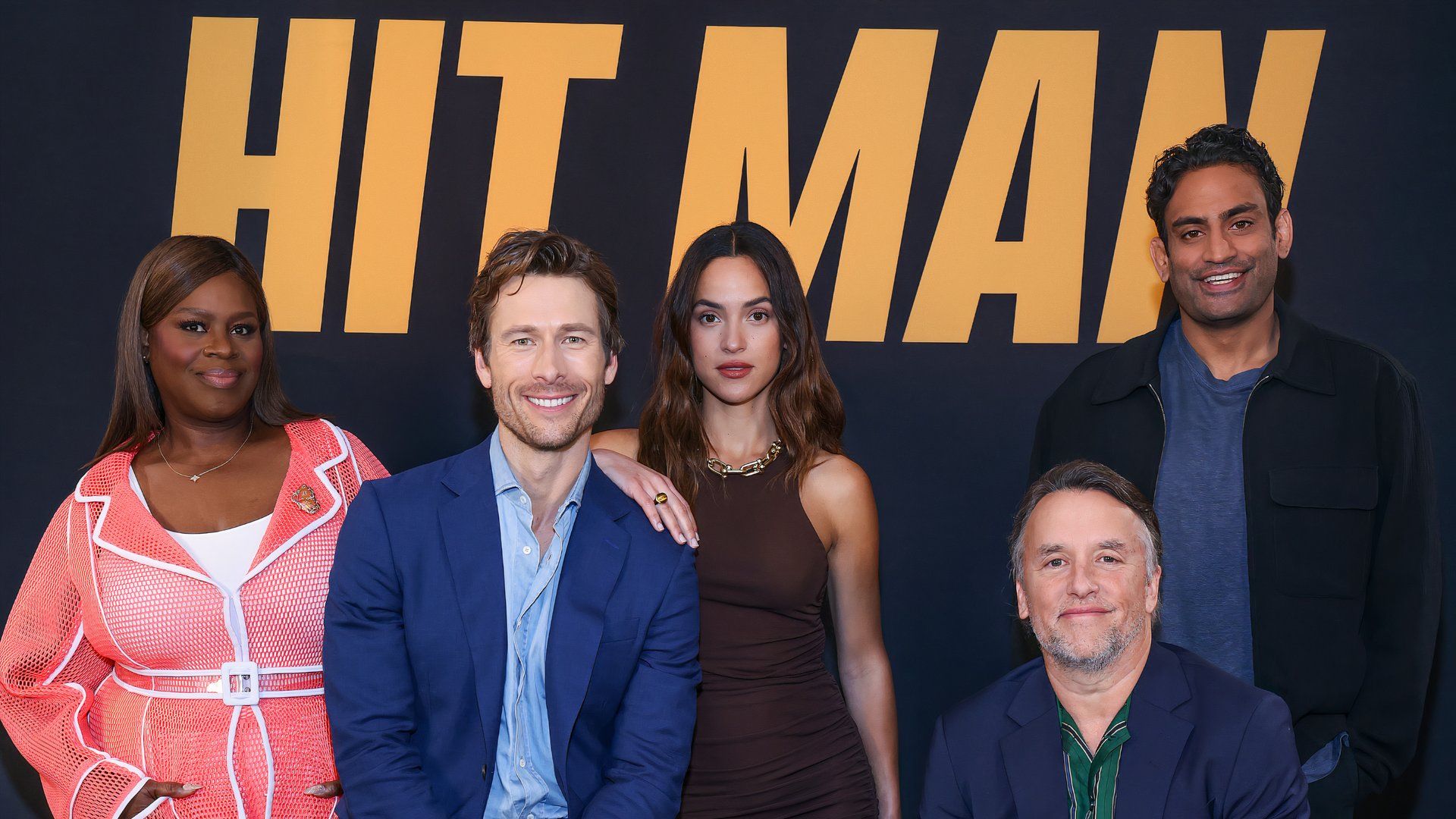 The cast of Hit Man on Netflix with Richard Linklater, Retta, Glen Powell, and Adria Arjona