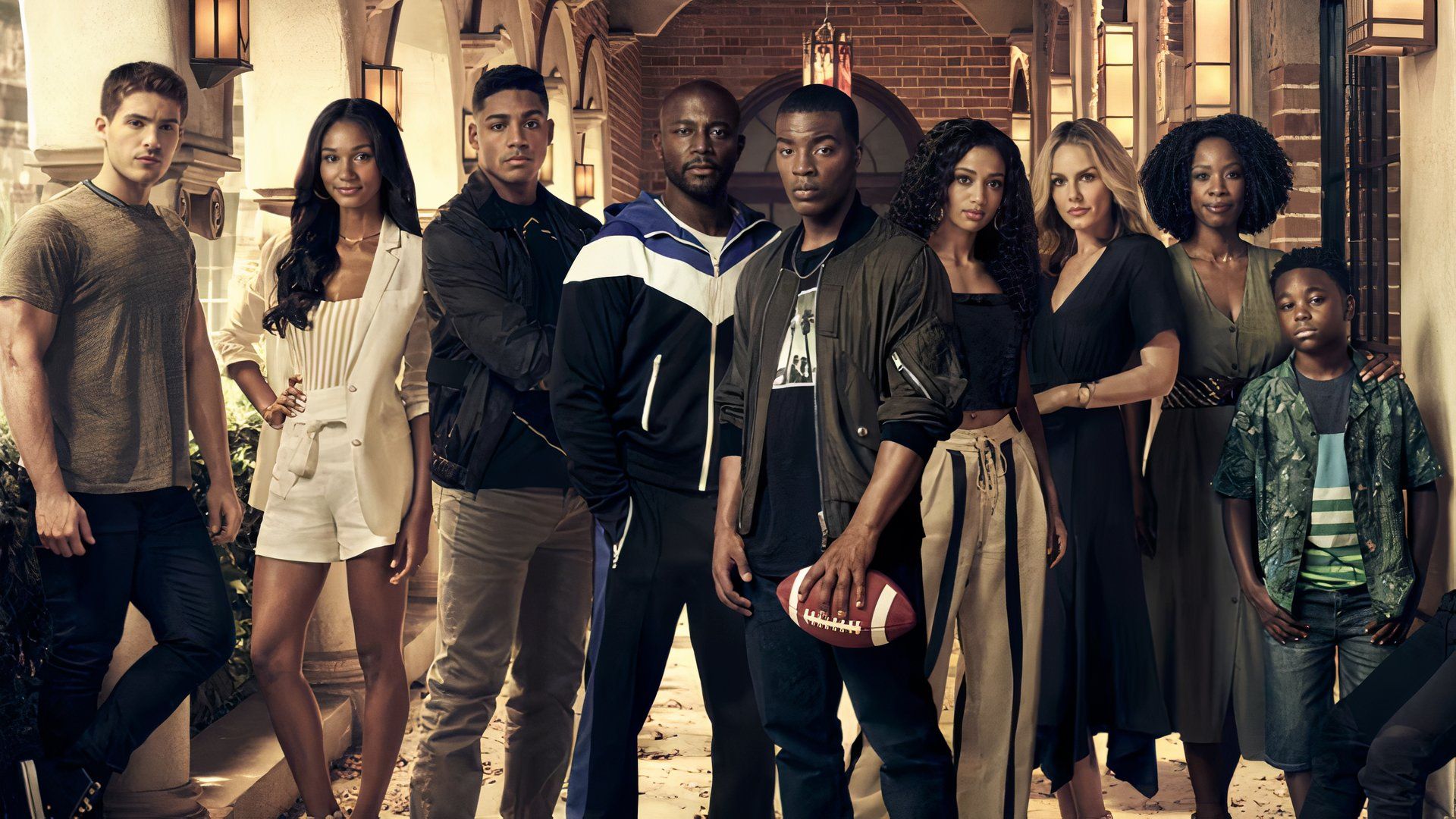The main cast of All American including Daniel Ezra as Spencer James with Taye Diggs as Billy and Bre-Z as Tamia