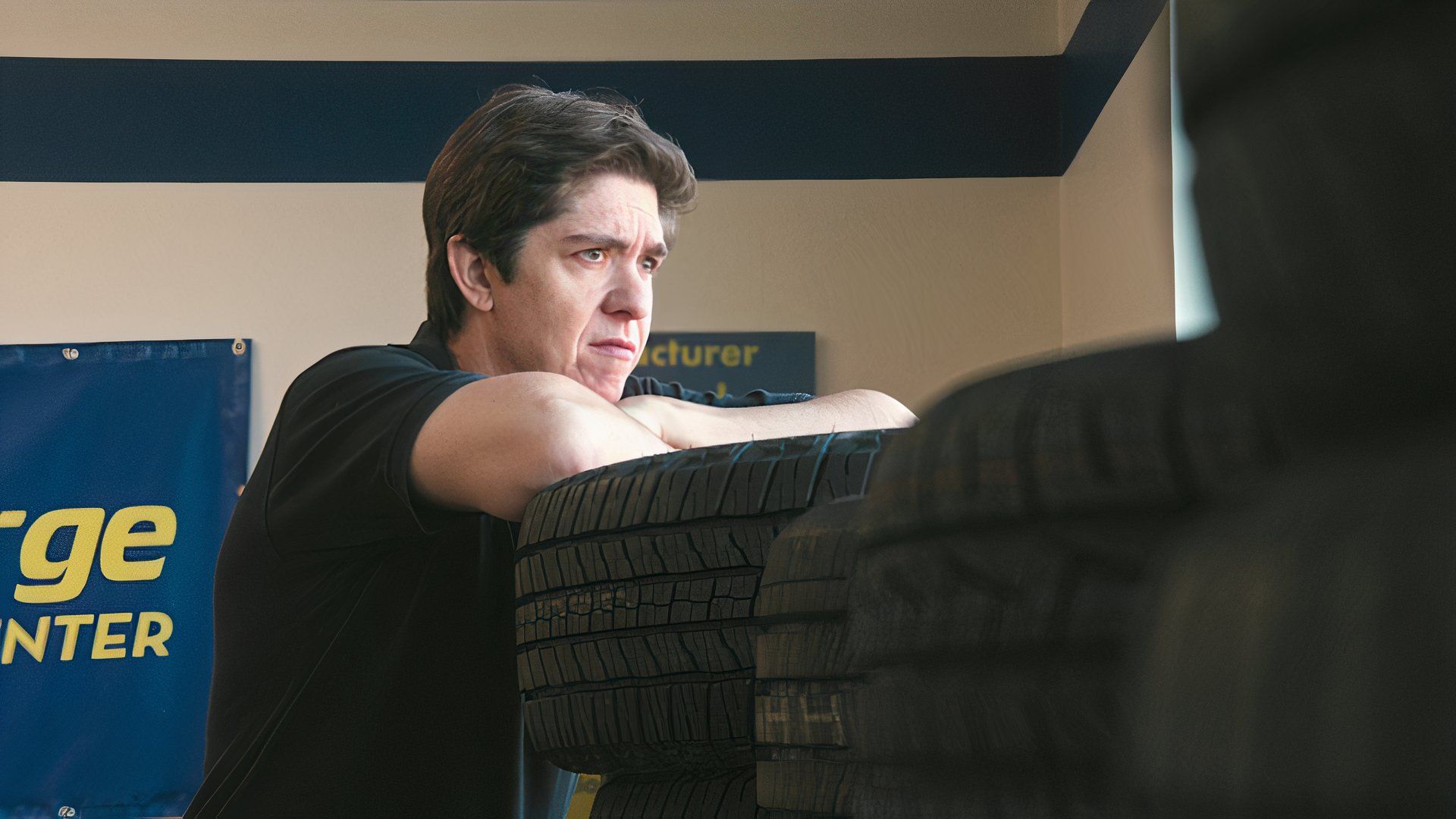 Will leans on tires in Tires