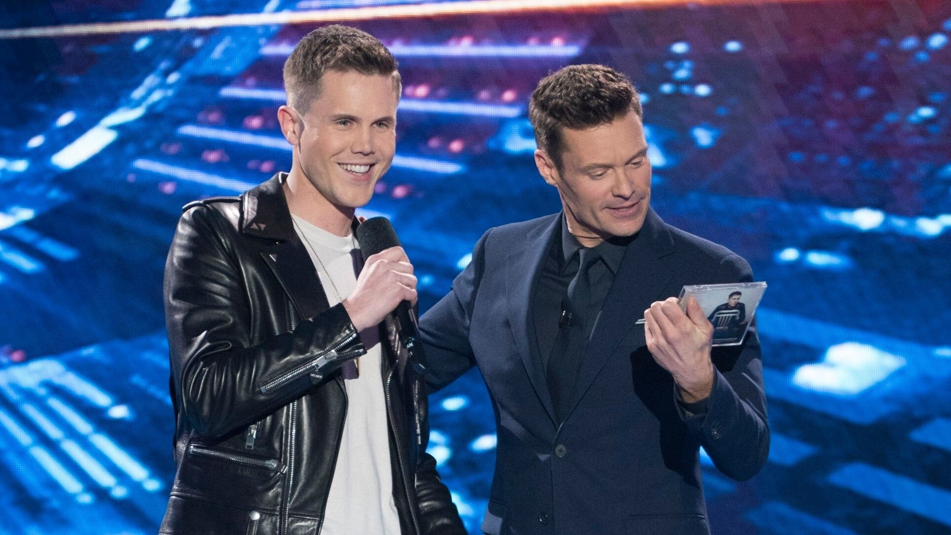 Trent Harmon and Ryan Seacrest on stage during American Idol 15