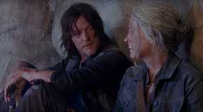 Daryl looking at Carol while sitting in a cave on The Walking Dead.