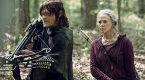 Daryl from The Walking Dead holding out a crossbow, Carol beside him