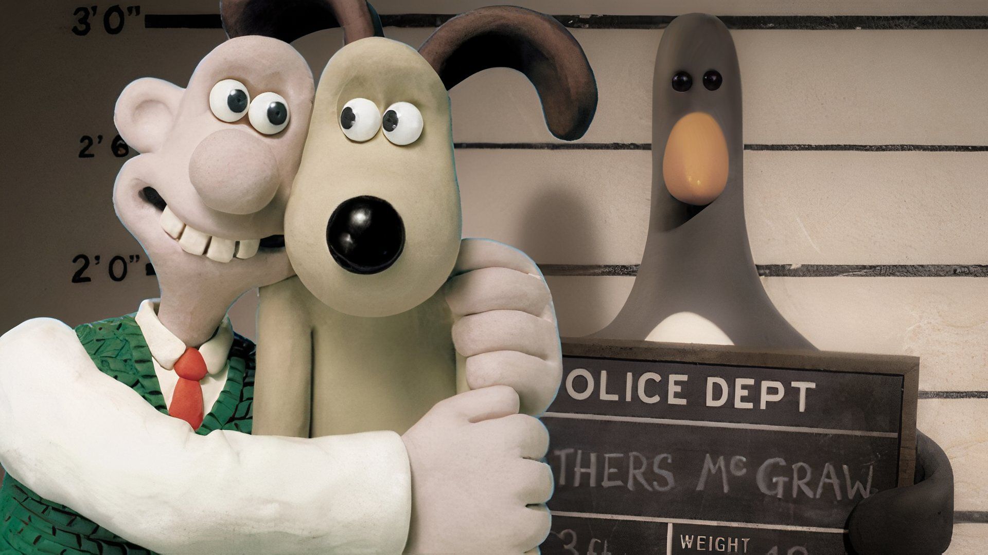Wallace and Gromit hugging alongside Feathers McGraw.