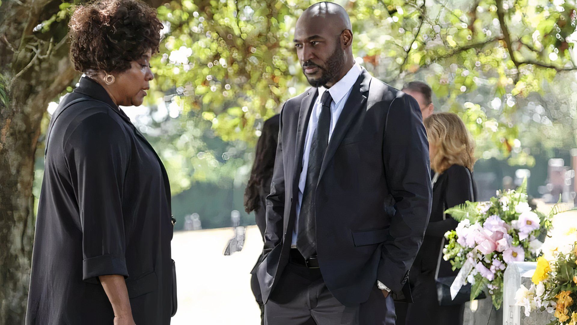 James Moseley (Adrian Holmes) talking to his estranged mother at a funeral in The CW's Supernatural.