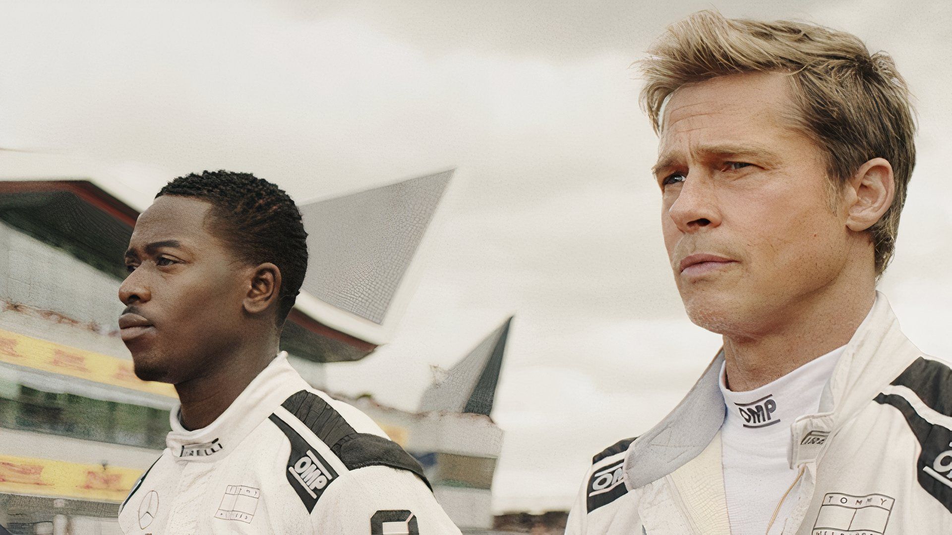 Brad Pitt stands alongside Damson Idris in the film F1