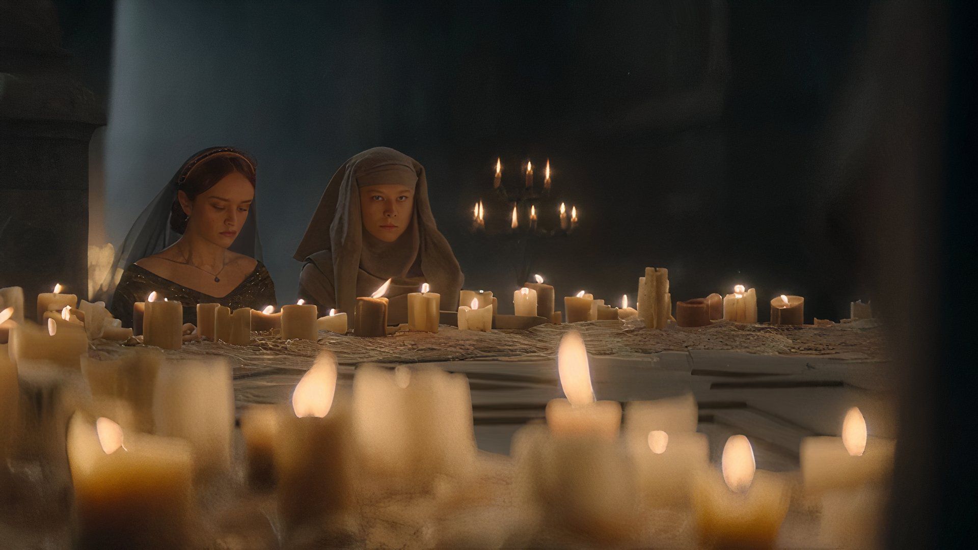 Alicent and Rhaenyra seemingly praying in a house of worship in House of the Dragon