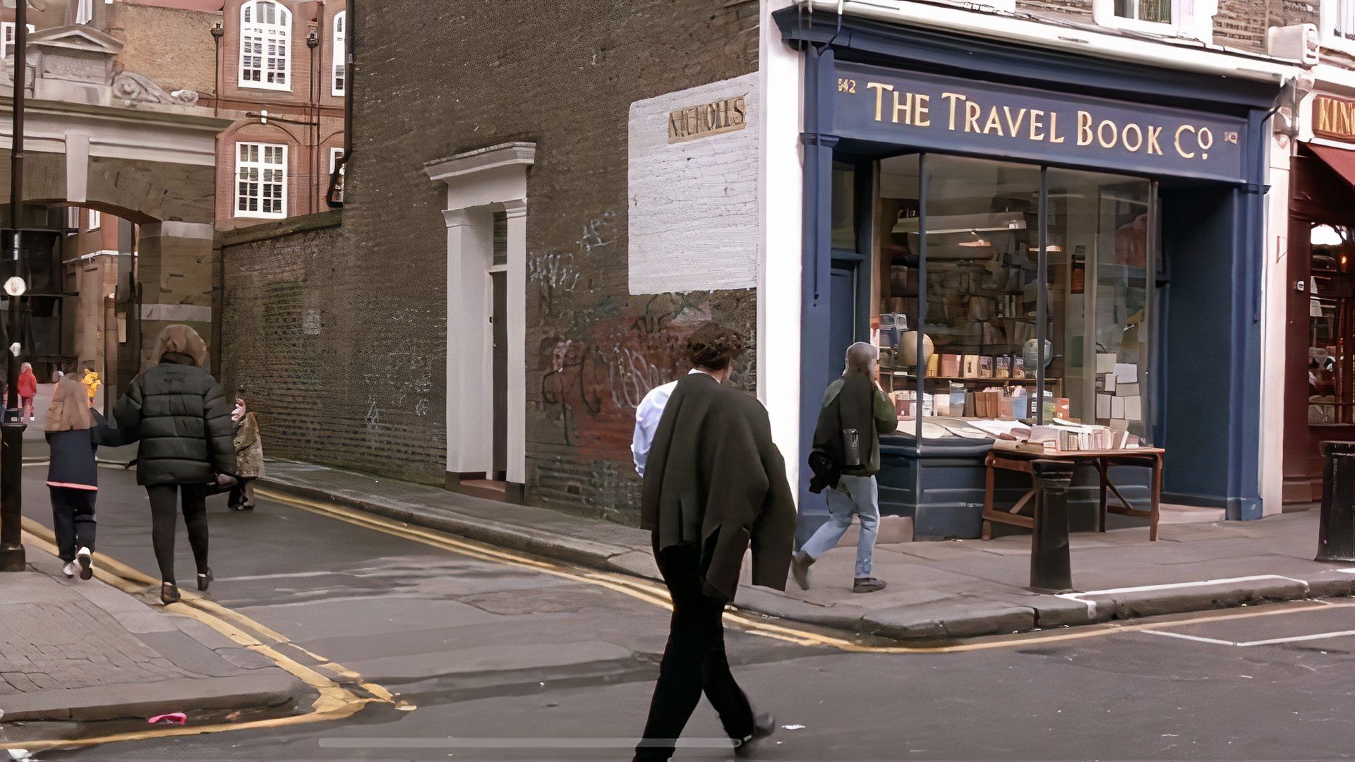 Hugh Grant walking into a bookstore in Notting Hill