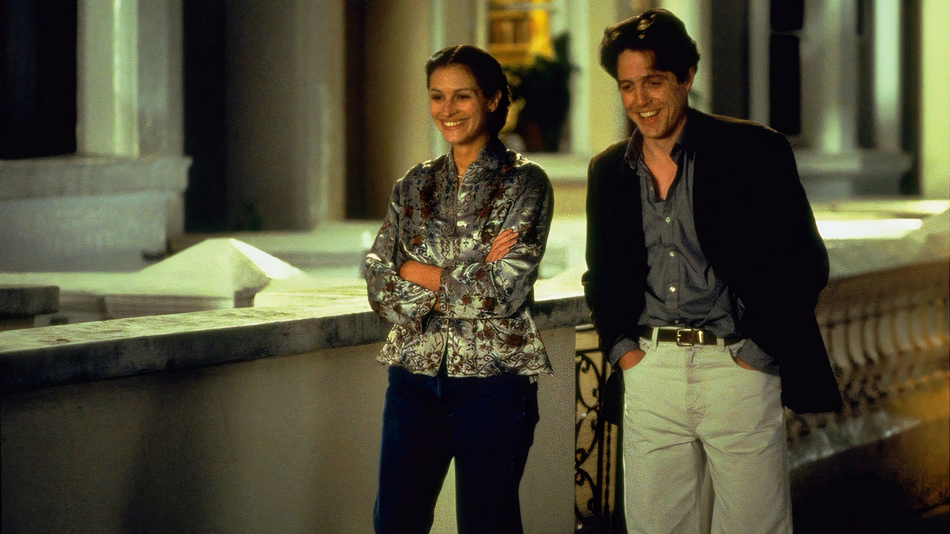 Hugh Grant and Julia Roberts walking outside together in Notting Hill