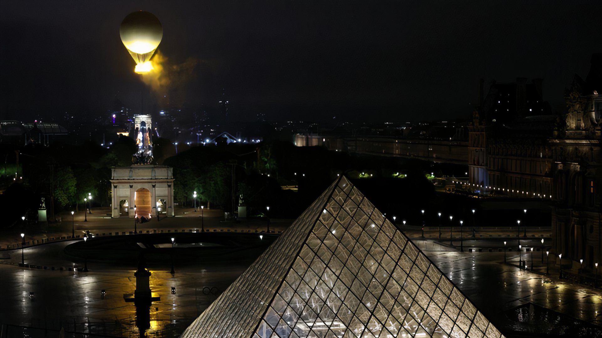 Olympic cauldron in a balloon over the Louvre Museum at the Paris 2024 Olympics