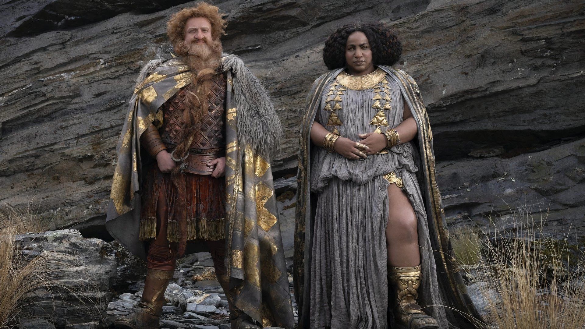 Durin and Disa in Rings of Power wearing grey and golden robes