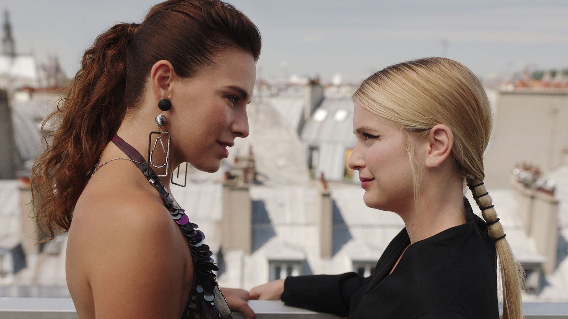 Sofia and Camille staring into one another's eyes on the rooftop in Emily in Paris