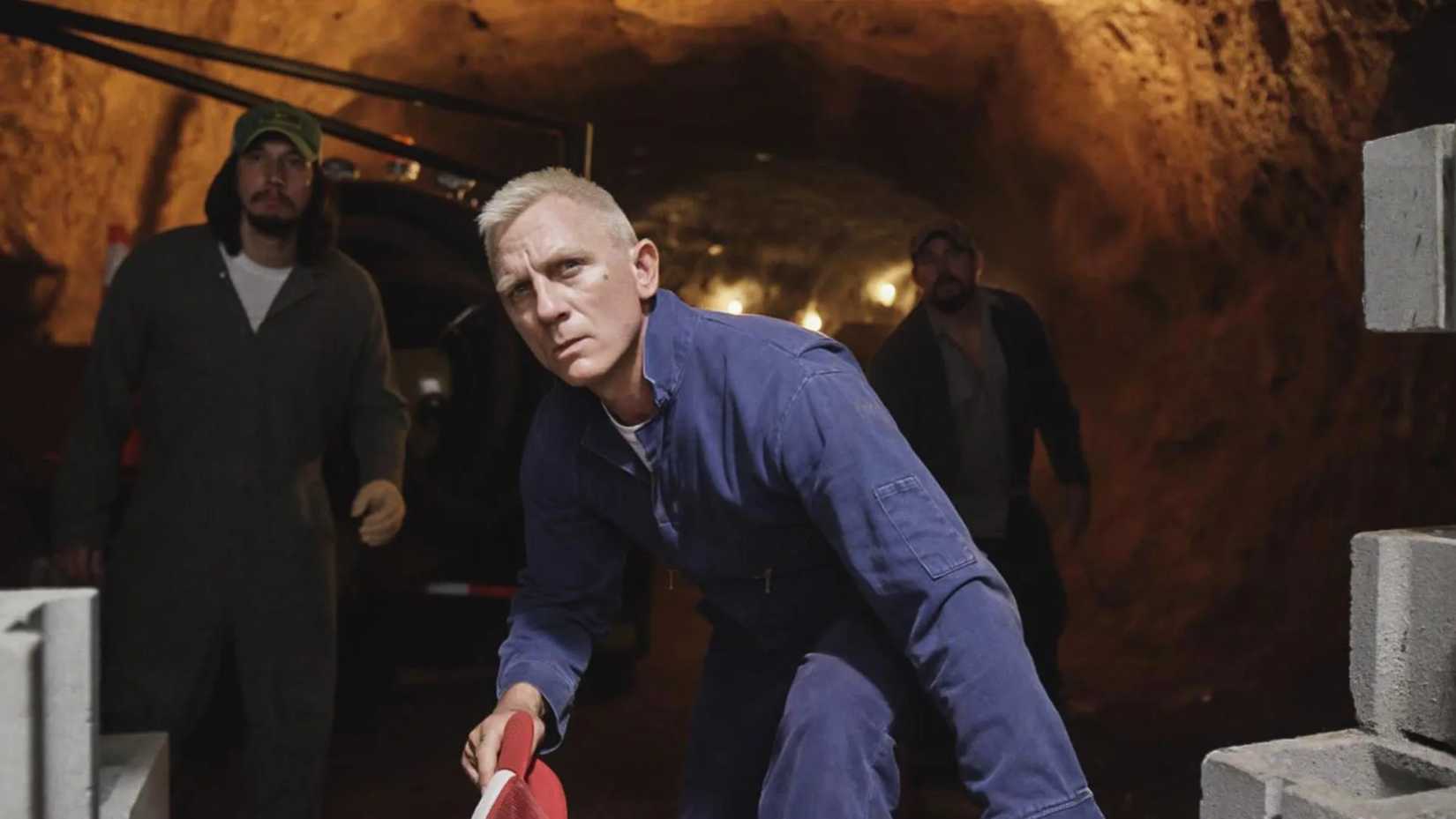 Daniel Craig in Lucky Logan walking through a tunnel 