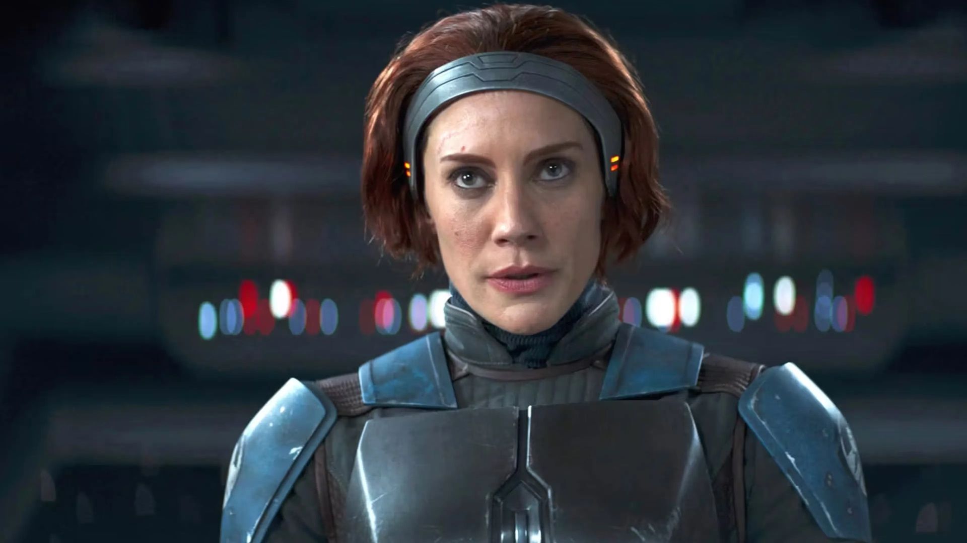 Katee Sackhoff as Bo-Katan stares at Moff Gideon in a scene from The Mandalorian.