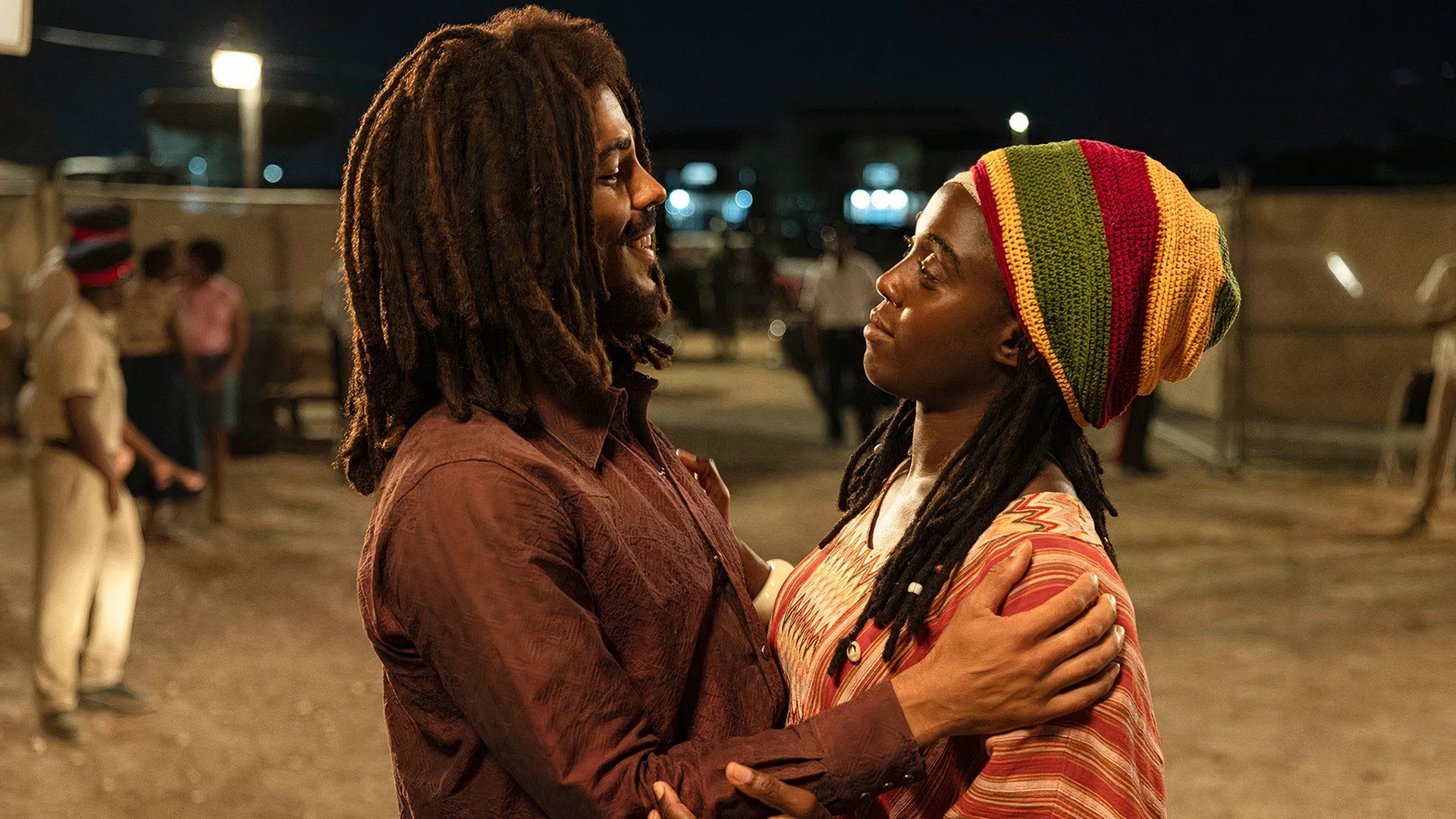 Bob embraces a woman in Bob Marley: One Love