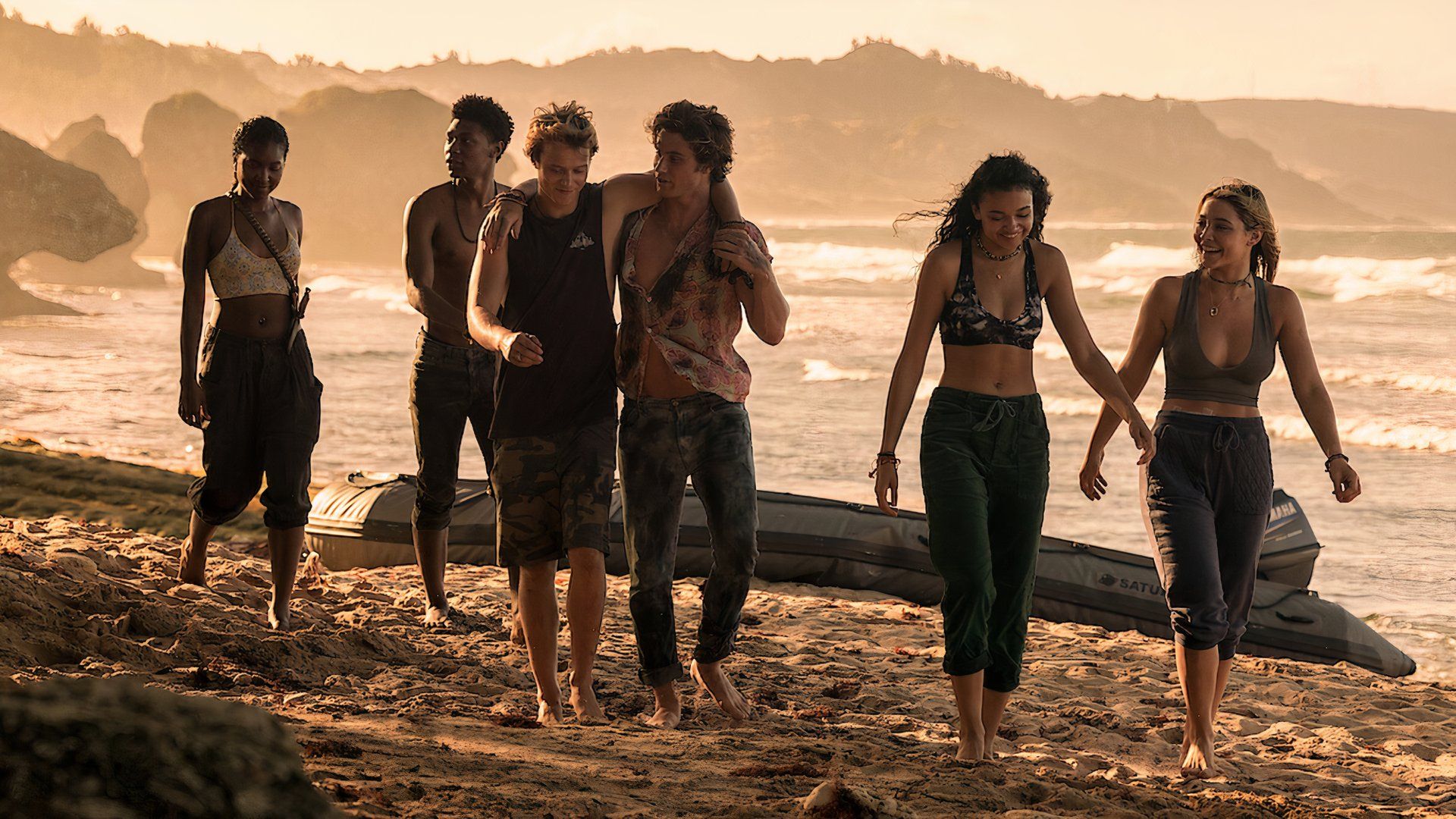 the Outer Banks main characters walking on the beach