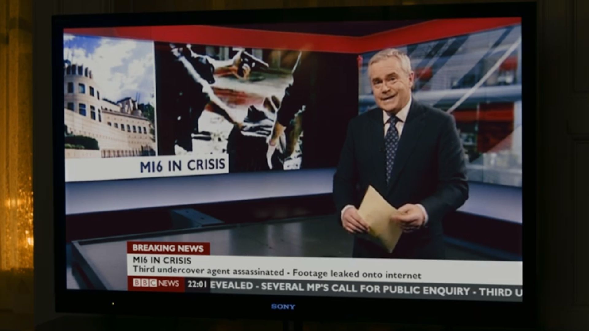 Huw Edwards plays himself in a newscast in a scene from Skyfall